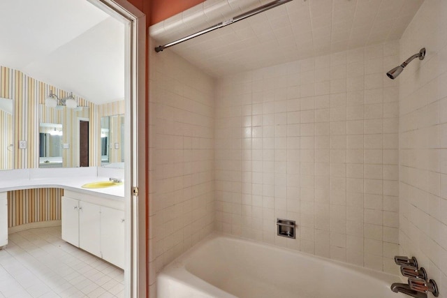 bathroom featuring bathing tub / shower combination and vanity