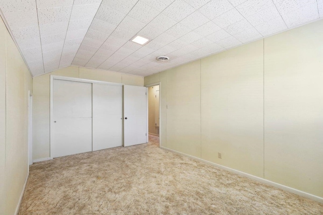 unfurnished bedroom featuring a closet, visible vents, and carpet floors