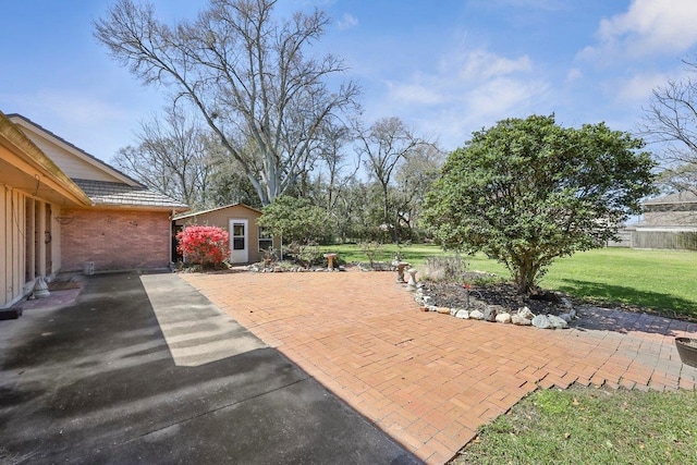 view of patio with an outbuilding