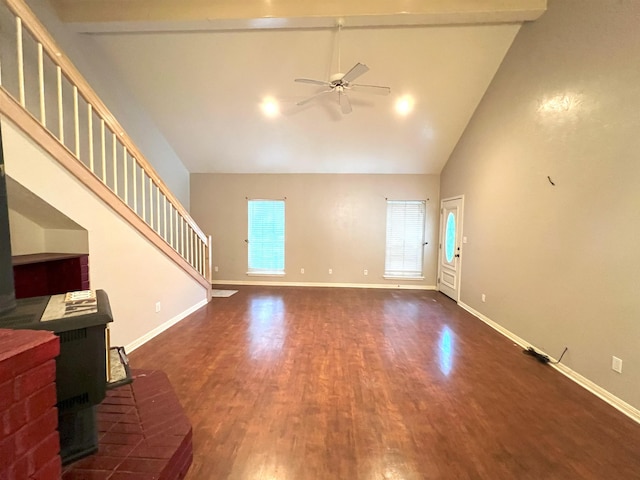 living room featuring beam ceiling, a wood stove, ceiling fan, high vaulted ceiling, and dark hardwood / wood-style floors