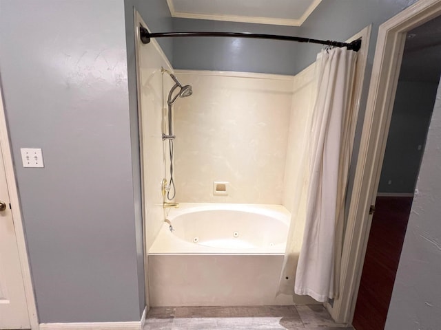 bathroom featuring ornamental molding and shower / tub combo with curtain