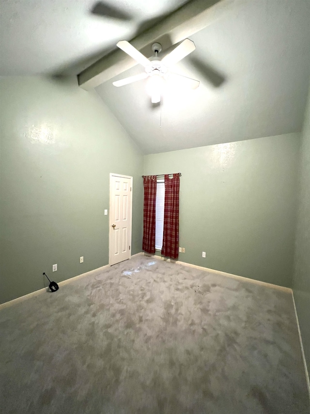 empty room with carpet, vaulted ceiling with beams, and ceiling fan