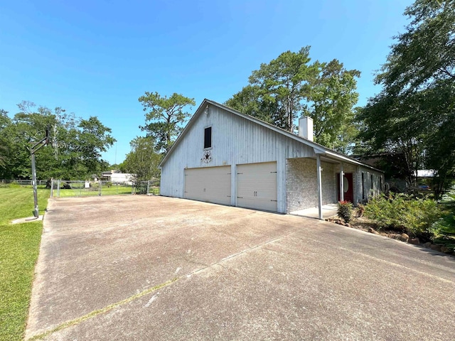 view of side of home with a garage