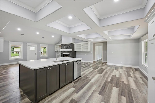 8679 Massey Lake Rd, Silsbee, TX 77656 - kitchen with open floor plan, dishwasher, a kitchen island with sink, light countertops, and light wood-type flooring