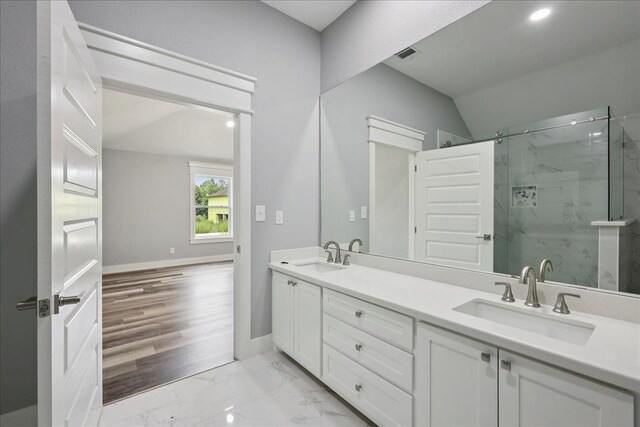 8679 Massey Lake Rd, Silsbee, TX 77656 - full bath with lofted ceiling, a marble finish shower, double vanity, and marble finish floors