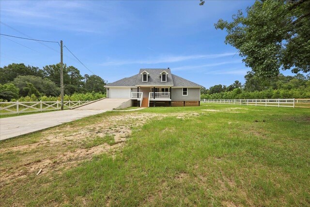 8679 Massey Lake Rd, Silsbee, TX 77656 - view of front of home featuring driveway, a garage, and a deck