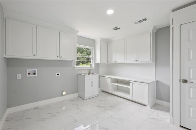8679 Massey Lake Rd, Silsbee, TX 77656 - laundry room featuring hookup for an electric dryer, cabinet space, washer hookup, light marble finish floors, and recessed lighting