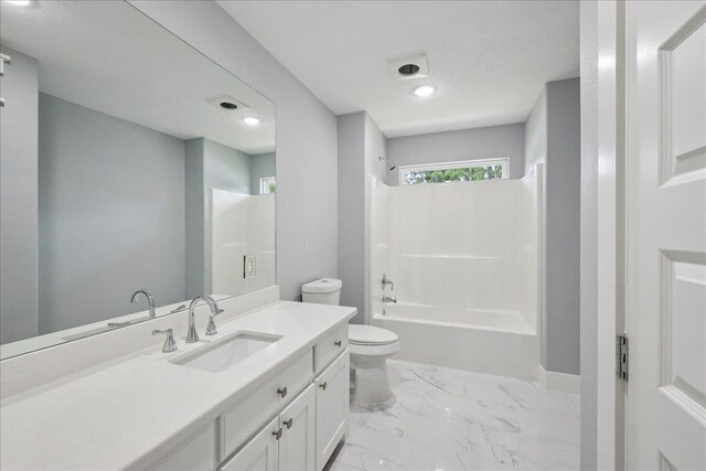 8679 Massey Lake Rd, Silsbee, TX 77656 - full bathroom with vanity, bathing tub / shower combination, and marble look tiles