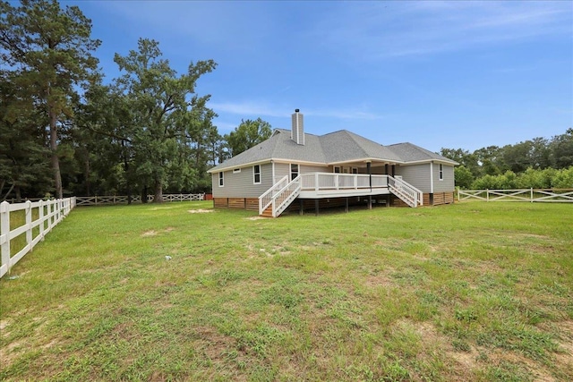 8679 Massey Lake Rd, Silsbee, TX 77656 - back of property with stairway, a deck, a fenced backyard, and a chimney