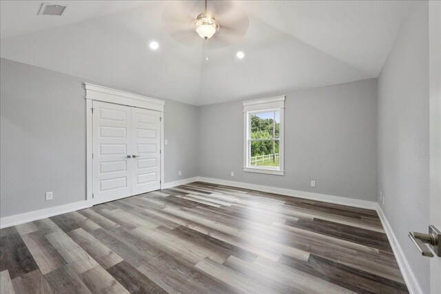 8679 Massey Lake Rd, Silsbee, TX 77656 - unfurnished bedroom featuring vaulted ceiling, wood finished floors, a closet, ceiling fan, and recessed lighting