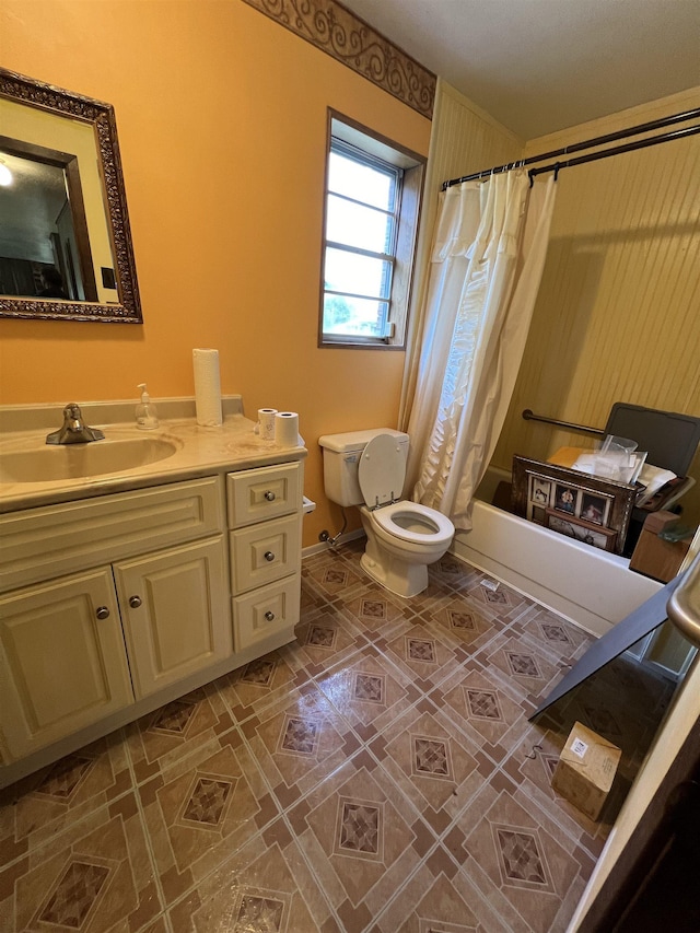 bathroom with toilet, vanity, shower / bath combo with shower curtain, and tile patterned flooring