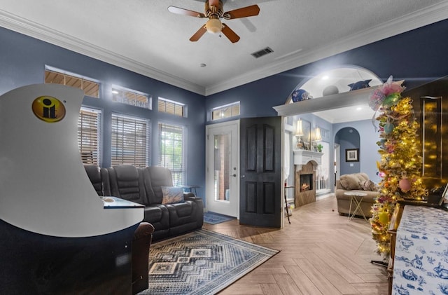 9655 Grapevine Dr, Orange, TX 77630 - living room featuring a ceiling fan, ornamental molding, and a lit fireplace