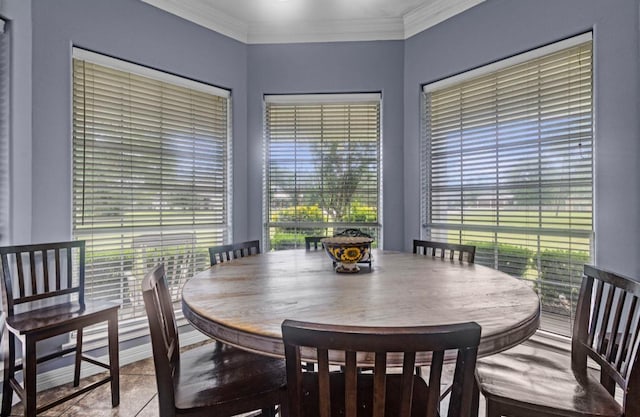 9655 Grapevine Dr, Orange, TX 77630 - tiled dining area with plenty of natural light and ornamental molding