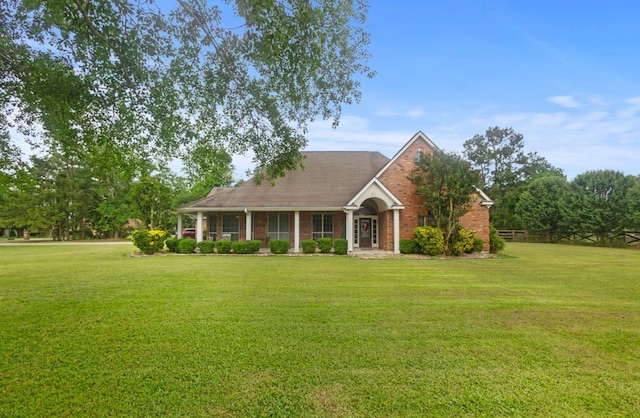 9655 Grapevine Dr, Orange, TX 77630 - view of front of property featuring a front lawn and brick siding