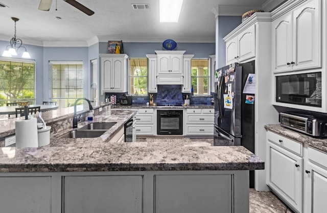 9655 Grapevine Dr, Orange, TX 77630 - kitchen with a sink, black appliances, a ceiling fan, white cabinetry, and crown molding