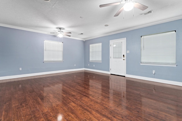 unfurnished room featuring ceiling fan, dark hardwood / wood-style flooring, a textured ceiling, and ornamental molding