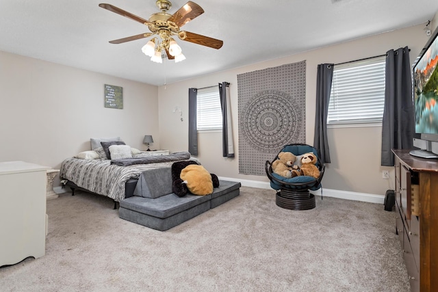 bedroom featuring light carpet and ceiling fan