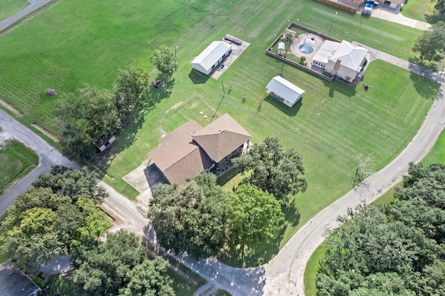 birds eye view of property with a rural view