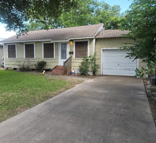 ranch-style house with a front lawn and a garage