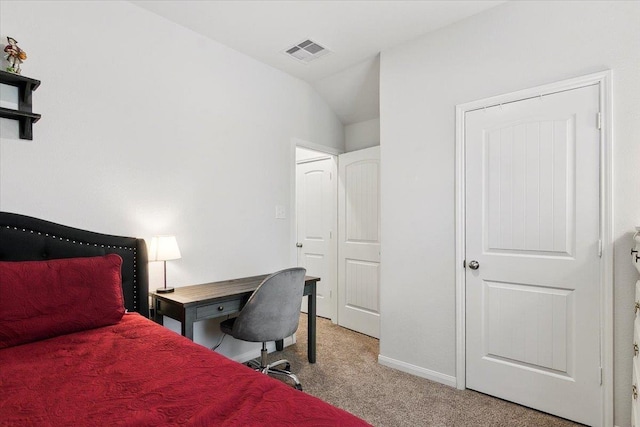 carpeted bedroom featuring vaulted ceiling