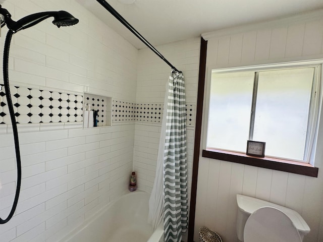 bathroom with shower / tub combo with curtain and toilet