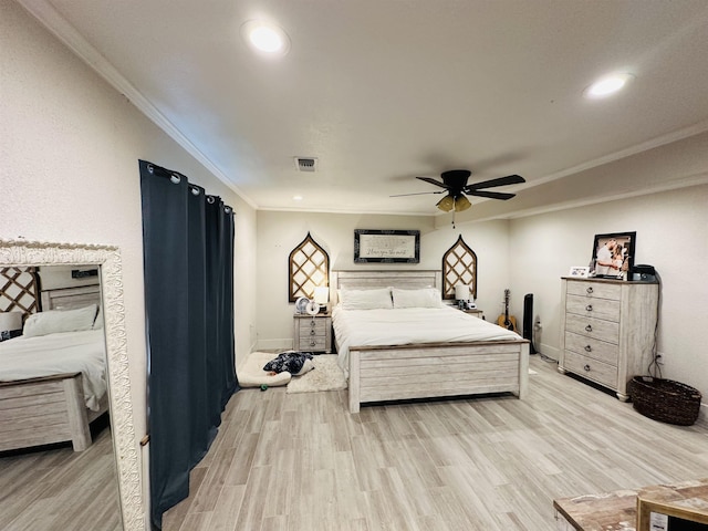 bedroom with light wood-type flooring, ceiling fan, and ornamental molding