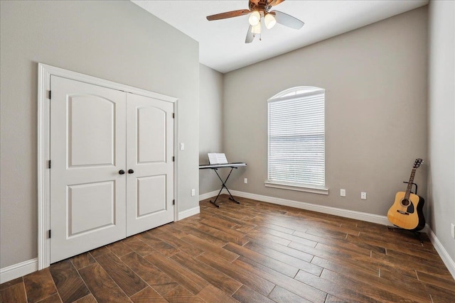 145 Colonial Estates Dr, Bridge City, TX 77611 - bedroom with dark wood-style floors, baseboards, a closet, and a ceiling fan