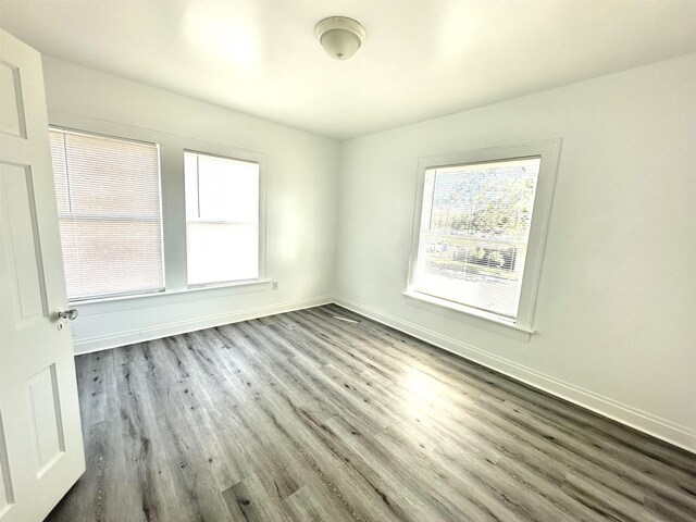 spare room featuring hardwood / wood-style floors