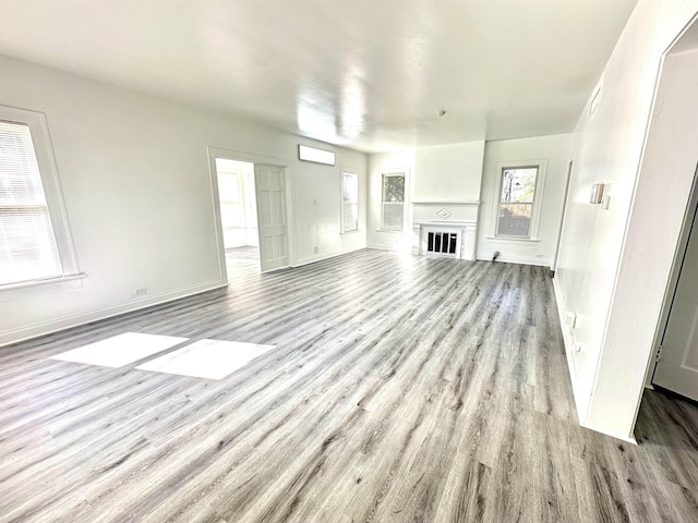 unfurnished living room with light hardwood / wood-style flooring