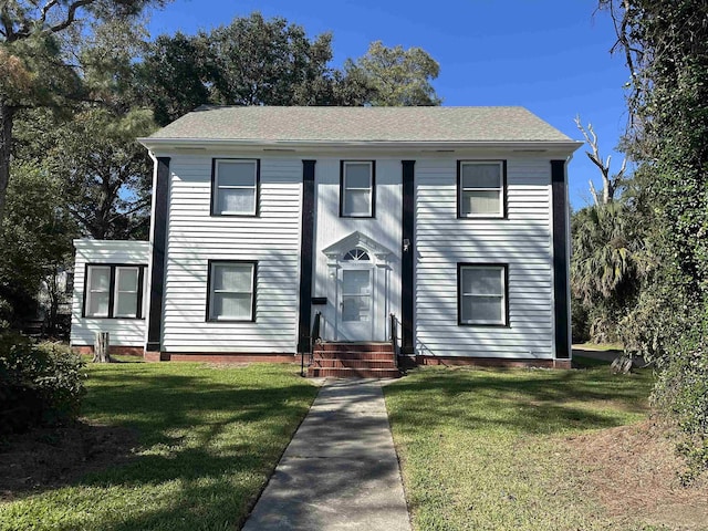 view of front facade with a front lawn