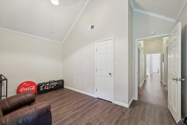 211 Skylark Ave, Bridge City, TX 77611 - sitting room with attic access, ornamental molding, wood finished floors, baseboards, and high vaulted ceiling