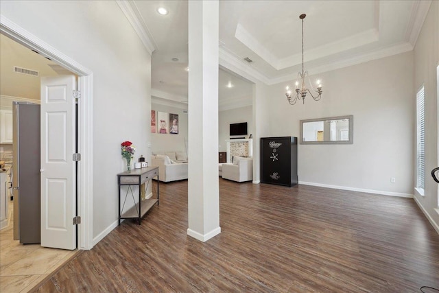 211 Skylark Ave, Bridge City, TX 77611 - living area with wood finished floors, crown molding, a chandelier, recessed lighting, and baseboards
