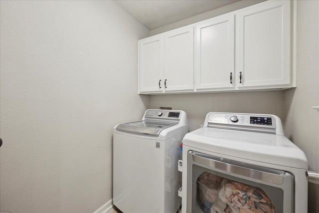 211 Skylark Ave, Bridge City, TX 77611 - laundry area featuring cabinet space and independent washer and dryer