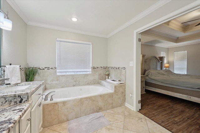 211 Skylark Ave, Bridge City, TX 77611 - bathroom with a bath, ensuite bath, crown molding, vanity, and a ceiling fan