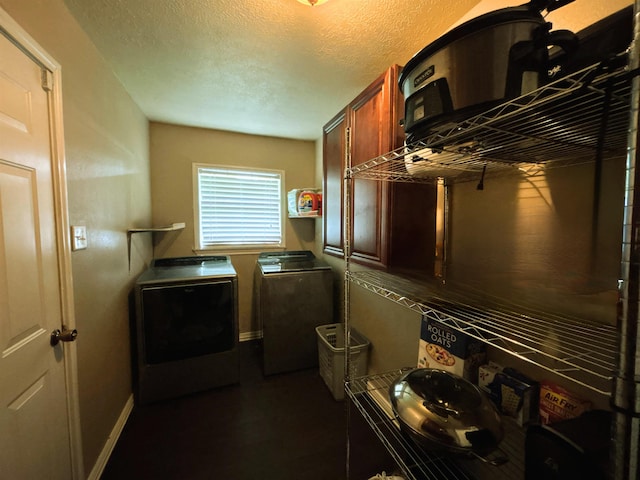 4400 Bethany St, Port Arthur, TX 77642 - laundry room featuring independent washer and dryer, cabinet space, a textured ceiling, and baseboards
