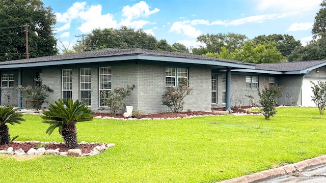 4400 Bethany St, Port Arthur, TX 77642 - view of front of house with a front lawn, brick siding, and a garage