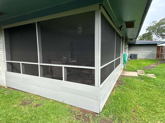 4400 Bethany St, Port Arthur, TX 77642 - view of side of home with cooling unit, a sunroom, a yard, and a ceiling fan