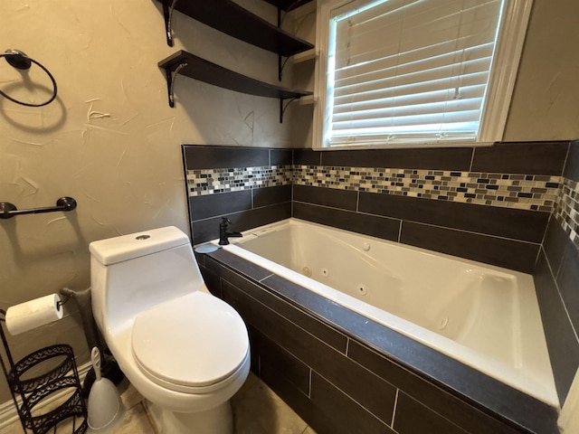 4400 Bethany St, Port Arthur, TX 77642 - full bathroom featuring a tub with jets and toilet