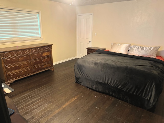 4400 Bethany St, Port Arthur, TX 77642 - bedroom featuring dark wood-style flooring and baseboards