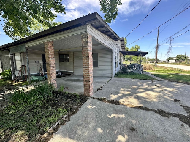 view of property exterior featuring a carport