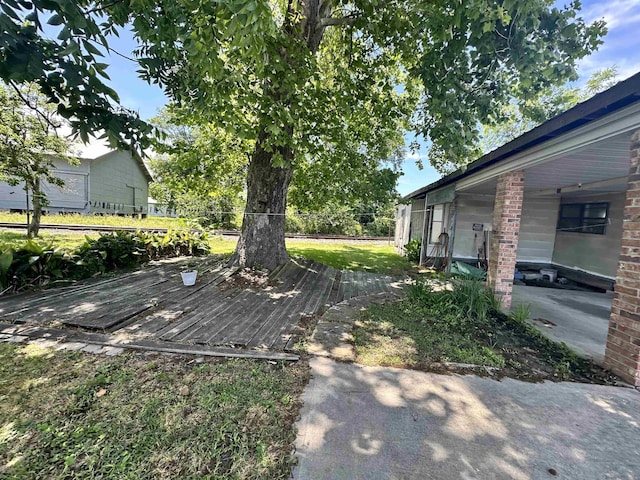 view of yard featuring a wooden deck