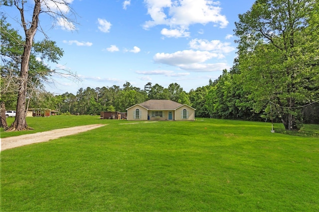 3329 Model Dr, Kountze, TX 77625 - view of front of home featuring dirt driveway and a front lawn