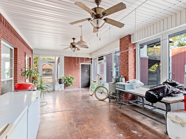 sunroom with ceiling fan and a healthy amount of sunlight