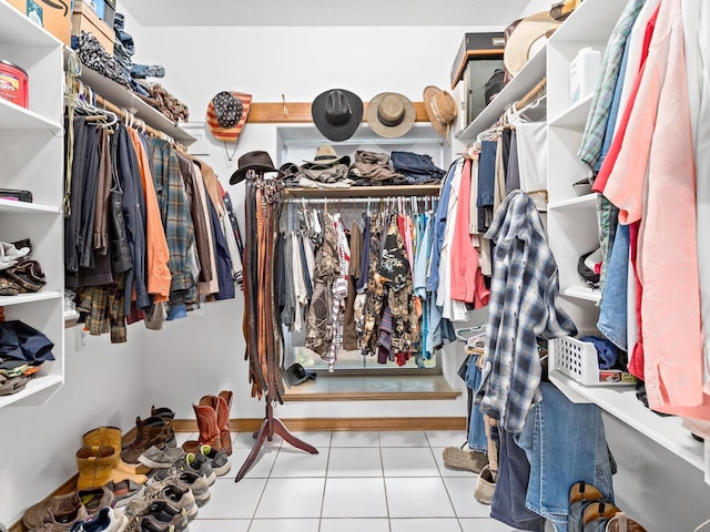 spacious closet with light tile patterned floors