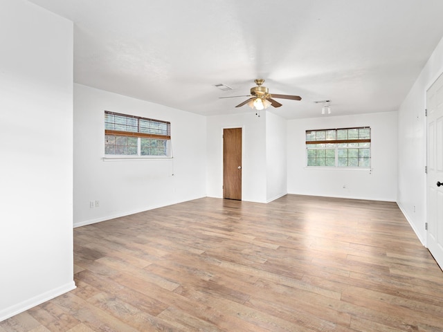 spare room with light hardwood / wood-style floors and ceiling fan