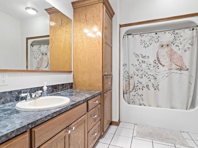 bathroom with tile patterned floors, vanity, and shower / tub combo