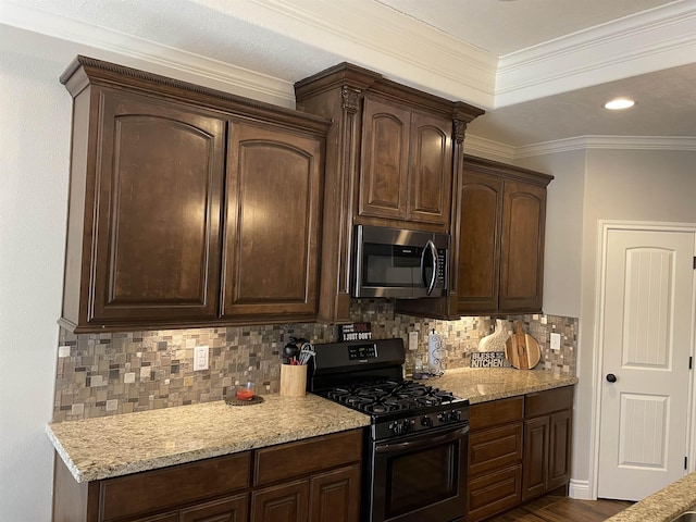 kitchen featuring tasteful backsplash, dark brown cabinets, and gas stove