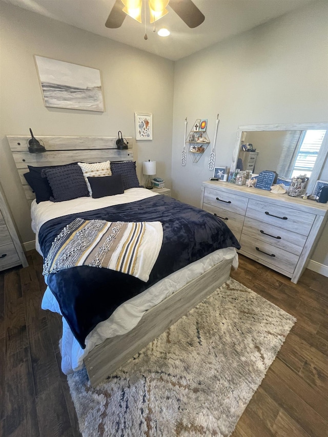 bedroom featuring dark hardwood / wood-style flooring and ceiling fan