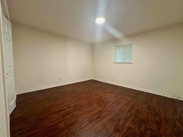 790 Pinchback Rd, Beaumont, TX 77707 - spare room with dark wood-style floors and baseboards