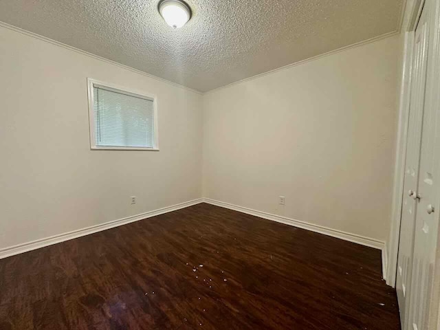 790 Pinchback Rd, Beaumont, TX 77707 - empty room featuring dark wood-style floors, a textured ceiling, and baseboards